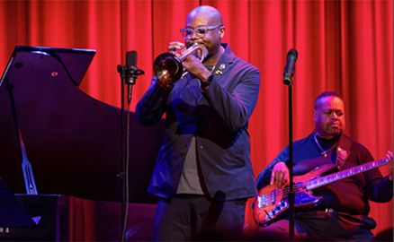 Sean Jones on trumpet and Dwayne Dolphin on bass guitar during a musical performance at the Greer Cabaret Theater.